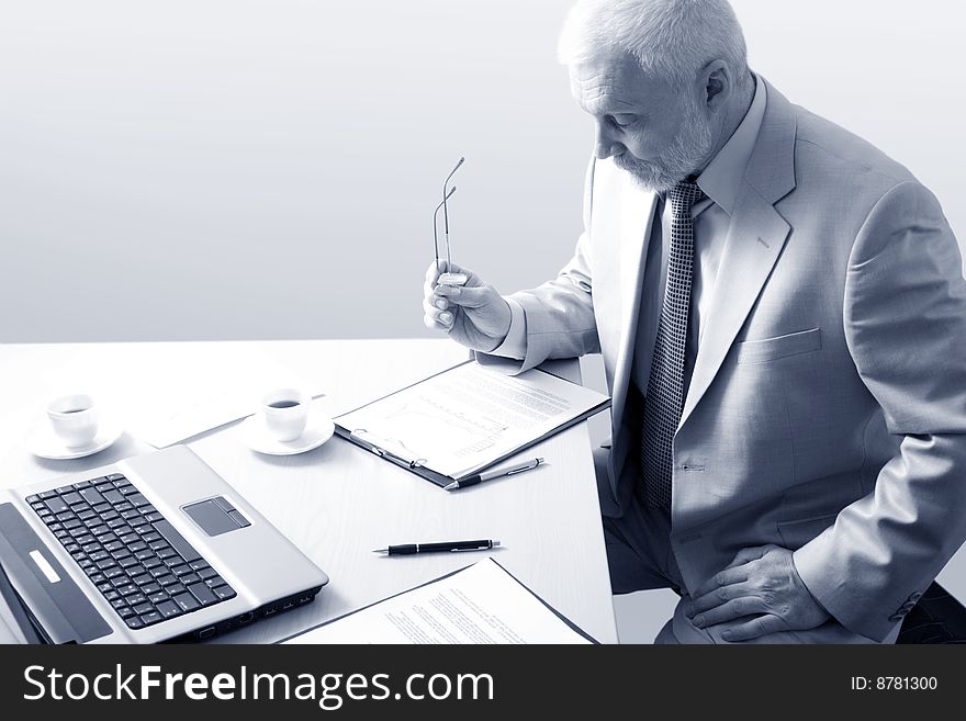 Businessman working in an office, white and black. Businessman working in an office, white and black