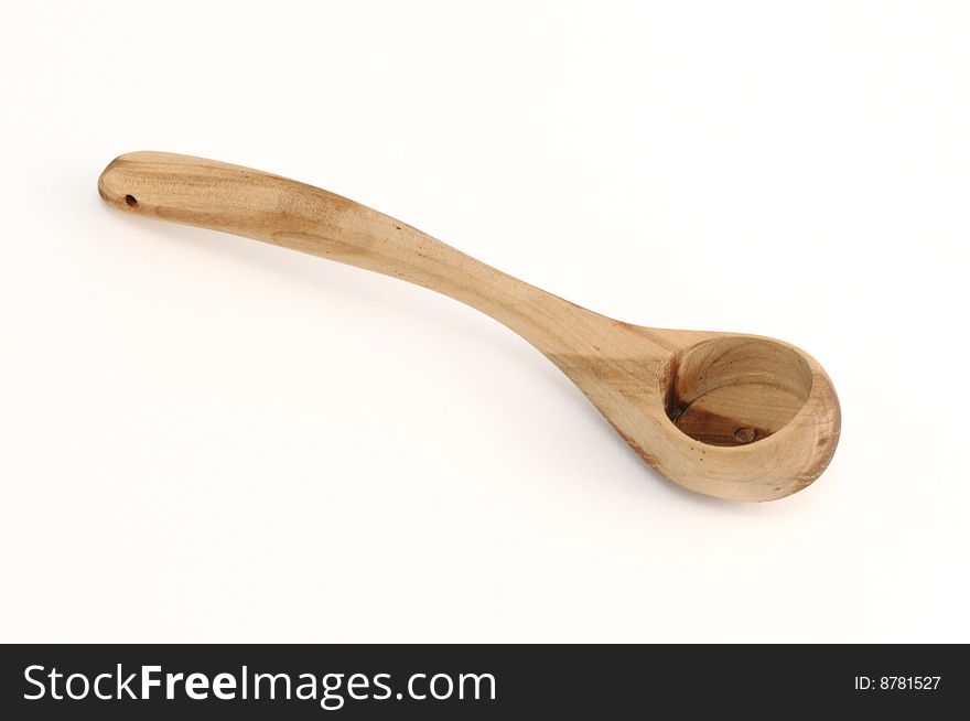 The small wooden Finnish spoon on a white background