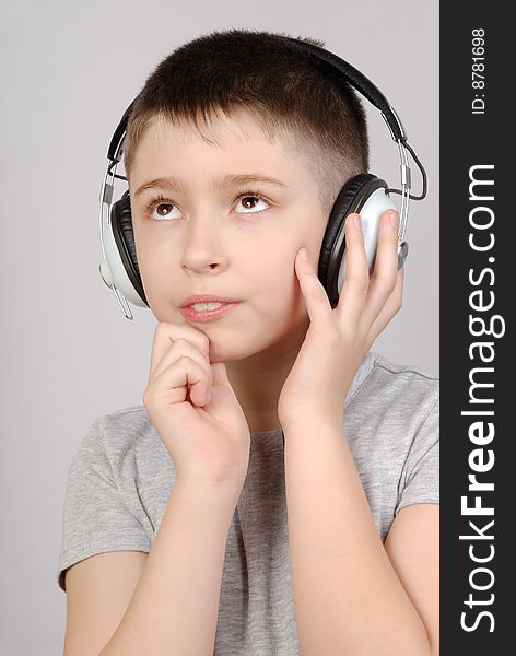 Portrait of listening boy in headphones