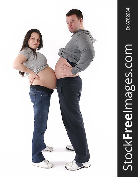 Pregnant woman and man touching with stomachs and smiling. Pregnant woman and man touching with stomachs and smiling