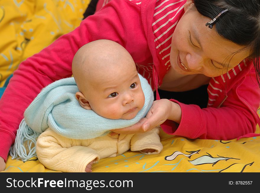 It is a cute chinese baby and his mother. he is 3 months. It is a cute chinese baby and his mother. he is 3 months.