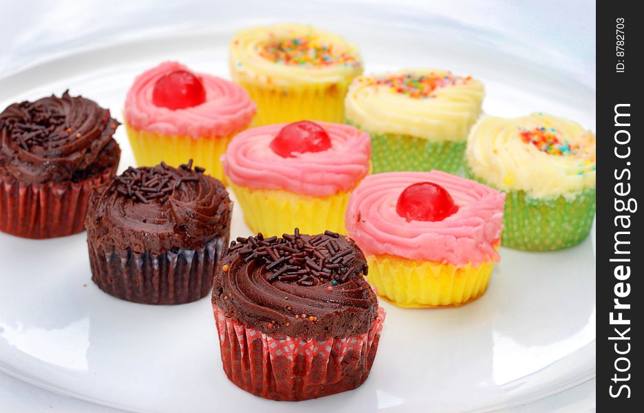 Collection of cupcakes in different colors. Collection of cupcakes in different colors