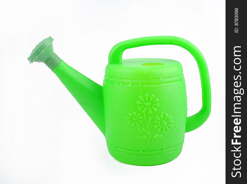 Side view of green plastic watering can.