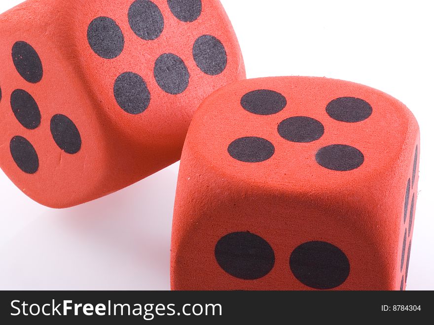 Close up of two dice on a white background. Close up of two dice on a white background.