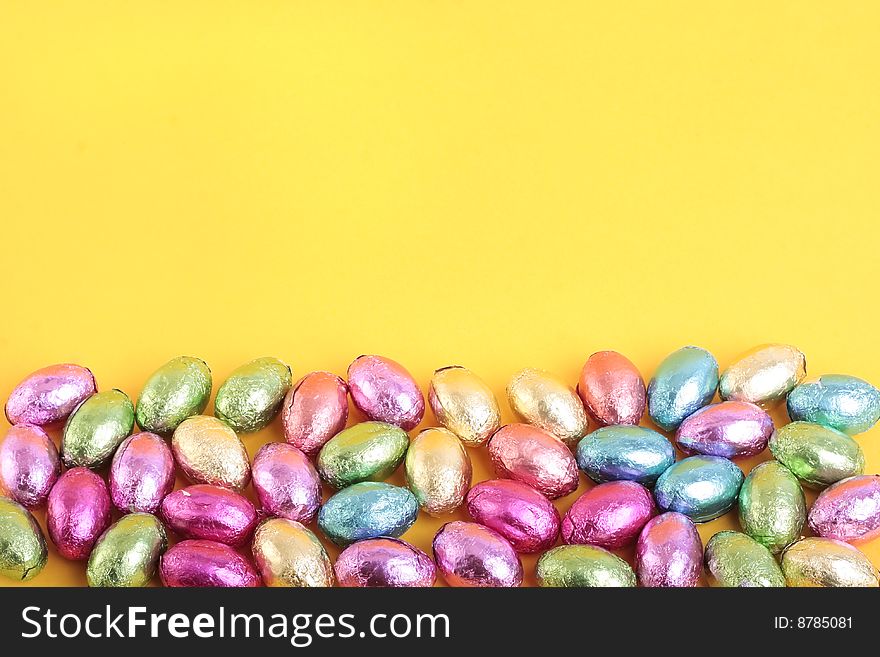 Easter eggs over yellow background