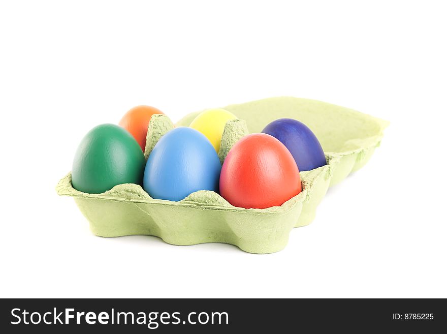 Colored Easter eggs in carton