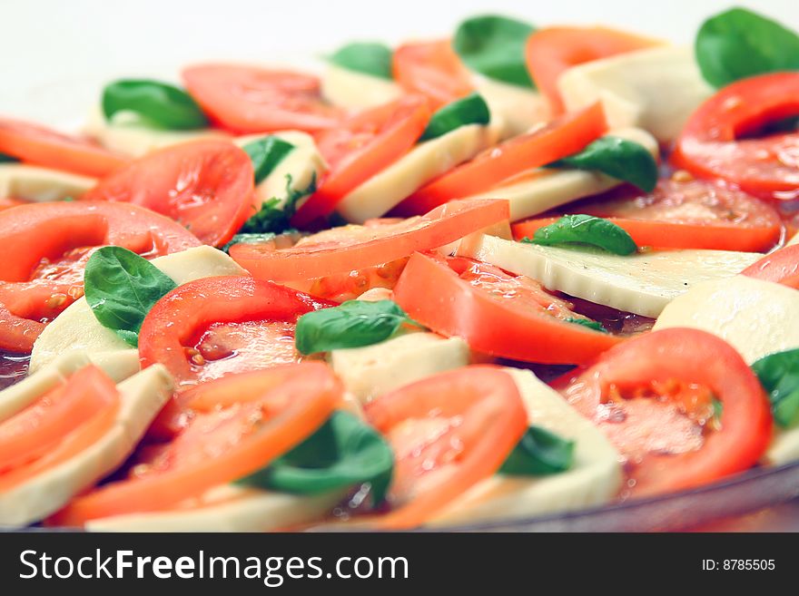 Close up of dish of tomato mozzarella salad. Close up of dish of tomato mozzarella salad