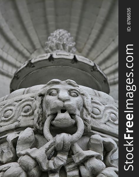 Lion Head Sculpture with Jaws Chomping Down on Stone Chain