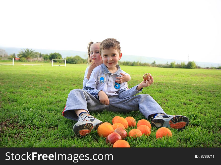 Two kids on the green grass. Two kids on the green grass