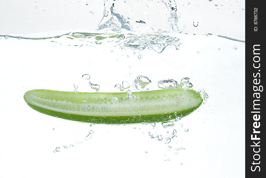 Vegetarian Food background.
Green cucumber