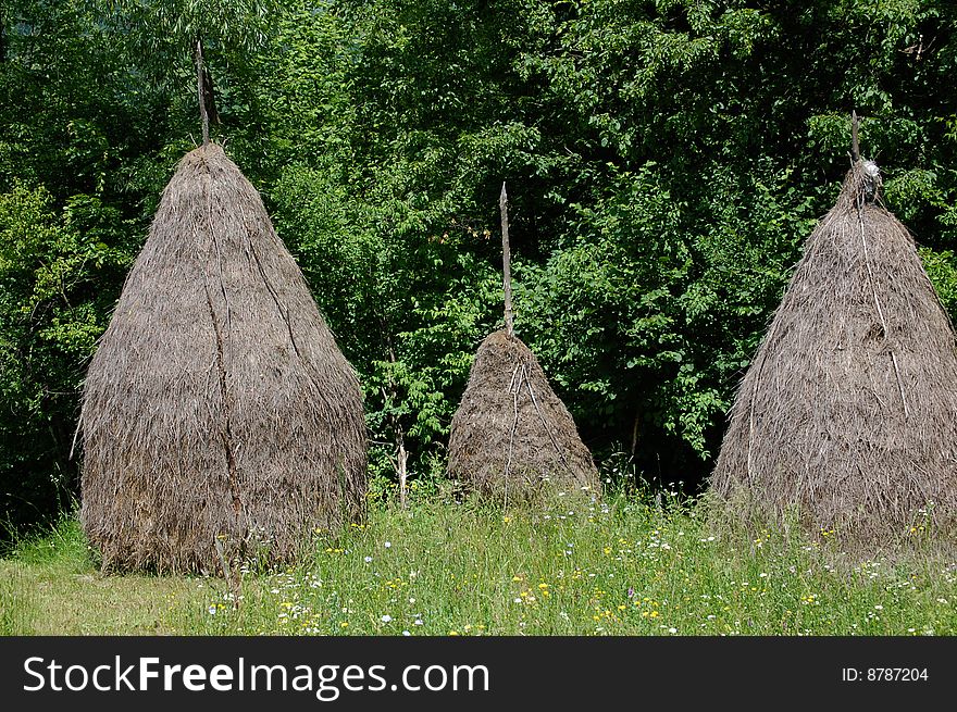 Three haystacks suggesitng the stillness of the countryside life. Three haystacks suggesitng the stillness of the countryside life