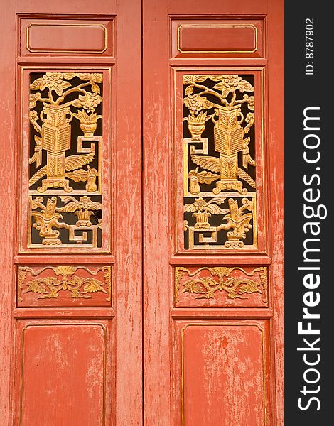Traditional Chinese style wood door, Wat Rat-orot, Bangkok, Thailand.