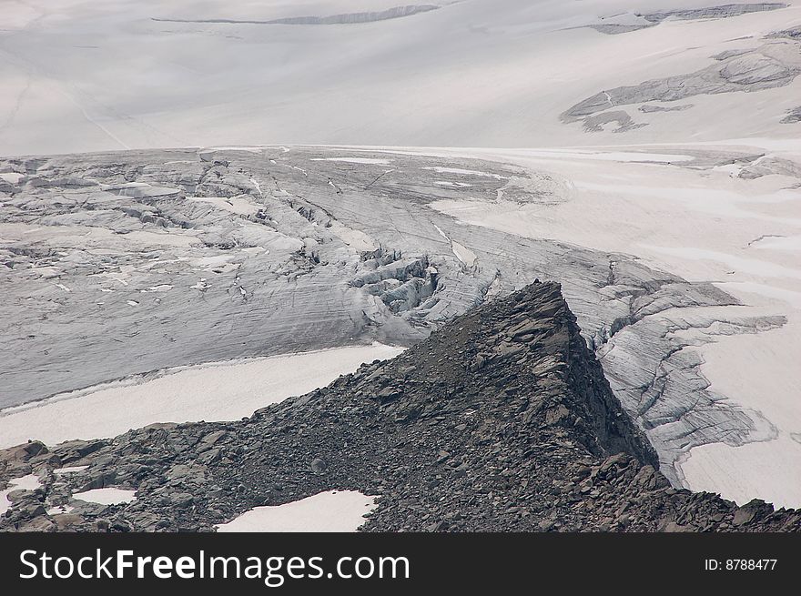 High mountain and glacier with cracks. High mountain and glacier with cracks