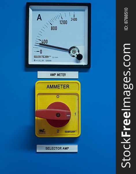 Industrial amperemeter with red on and off switch.