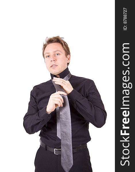 Businessman Putting On A Tie