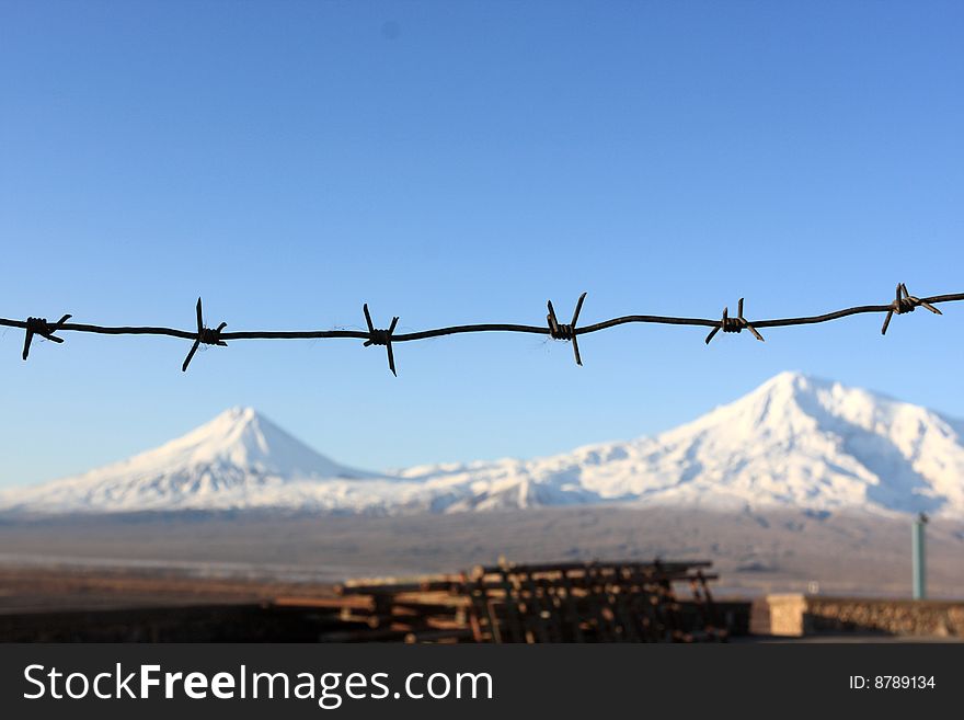 The mountain Ararat behind a barbed wire. The mountain Ararat behind a barbed wire