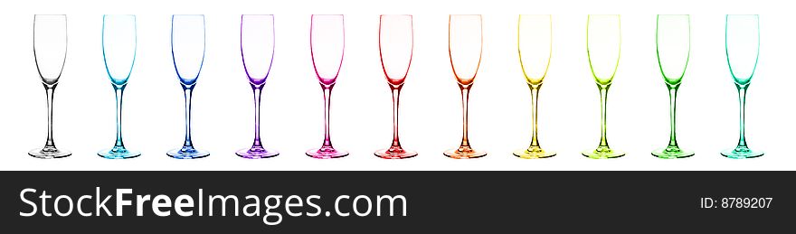 Set of multi-coloured glasses for champagne: red, orange, yellow, green, blue, dark blue, violet, pink, aquamarine, grey, citril. Over white. Set of multi-coloured glasses for champagne: red, orange, yellow, green, blue, dark blue, violet, pink, aquamarine, grey, citril. Over white.