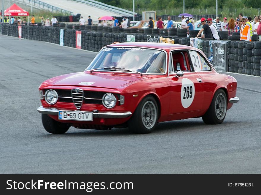 Alfa Romeo 1966 classic car competing in a retro automobile popular race.