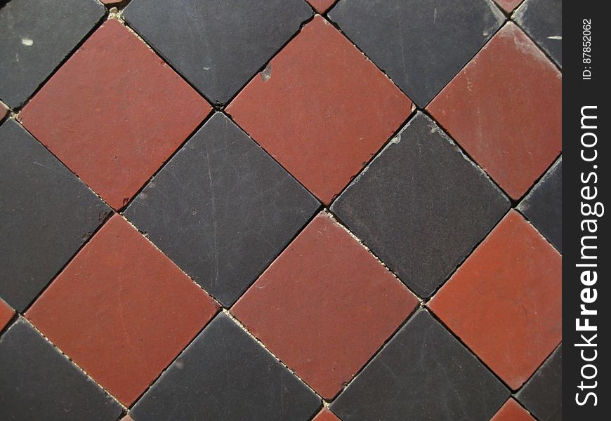 black-and-burgundy-diamond-pattern-tiles