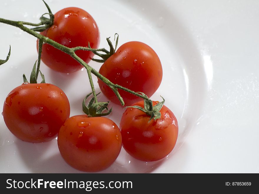 Photo of cherry tomatoes on display. This vegetable is actually a fruit of the berry family, used in salads, appetizer or garnish.