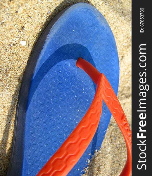 colorful-flip-flop-on-sand