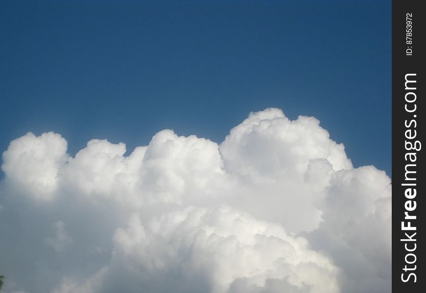 cumulus-clouds-against-blue-sky
