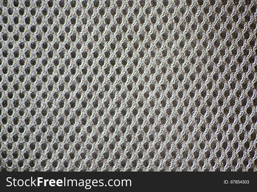 Texture of syntethic polymer used for a camera bag providing resistance and durability.