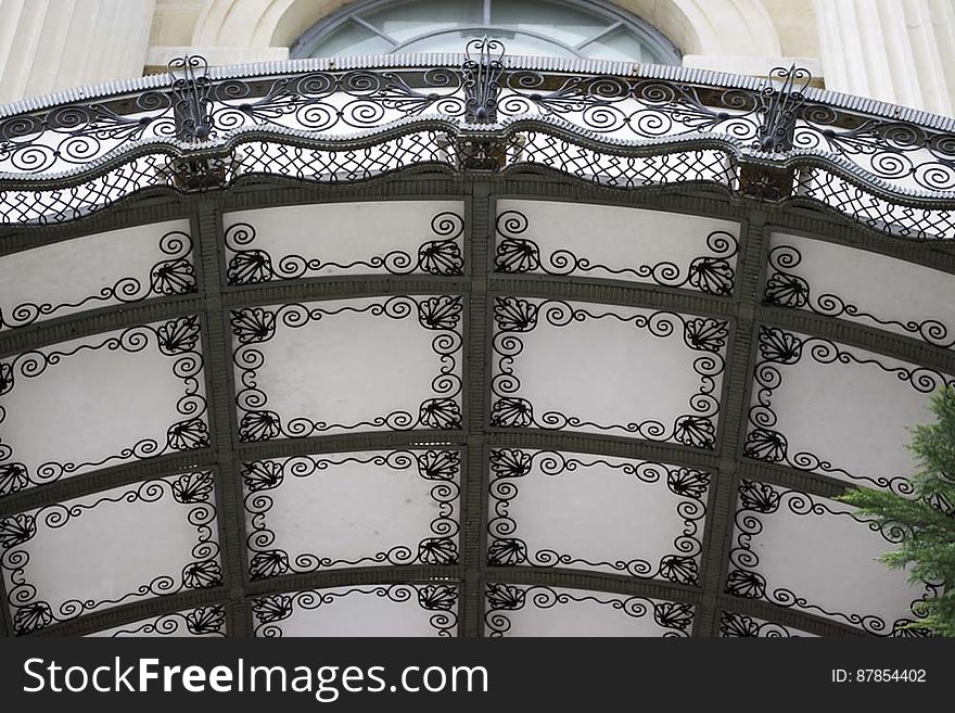 Glass canopy on decorative wrought iron frame. Glass canopy on decorative wrought iron frame.