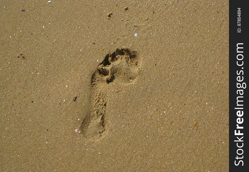 footprint-on-beach-sand