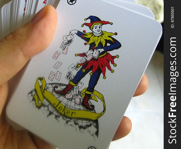 hand-holding-pack-of-cards