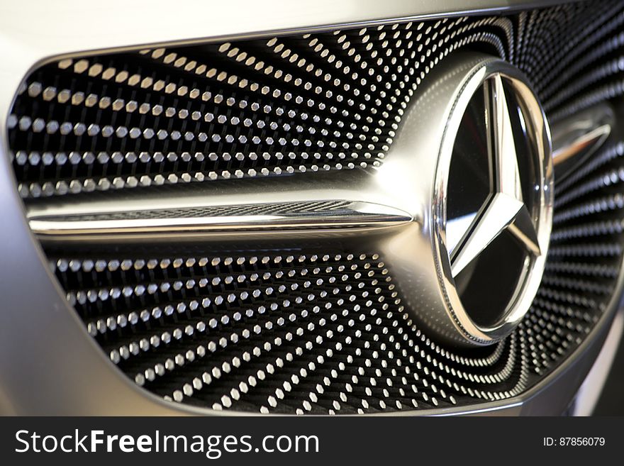 Photo of pattern on Mercedes concept car front grill. Silver hexagons create a starry sky motif.