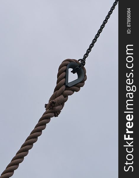 Manila rope and metal chain used to hold in place windmill blades.