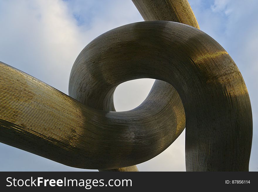 Intertwined Metallic Tubes Sculpture