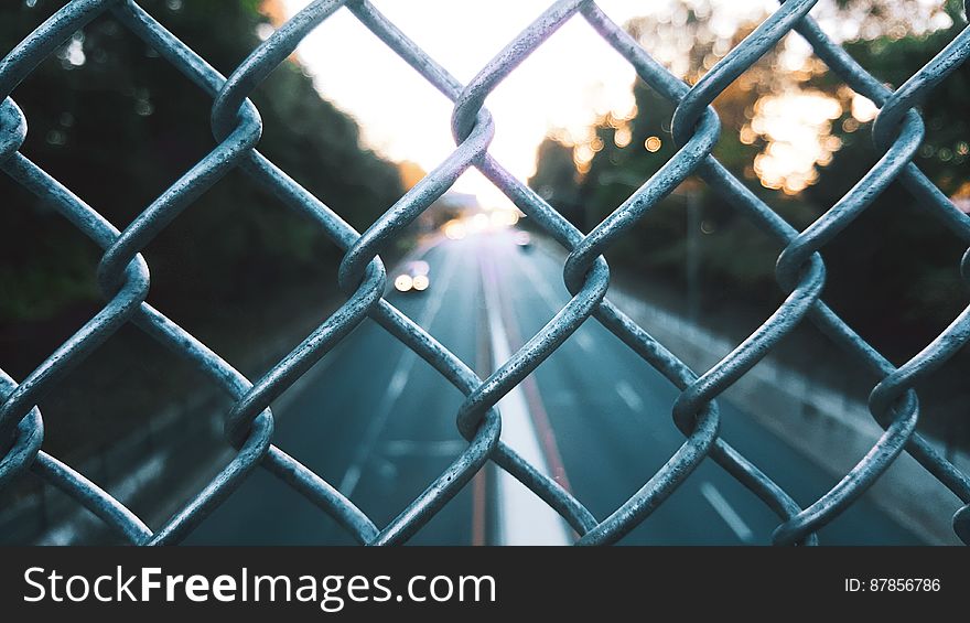 Streets Seen Through Fence