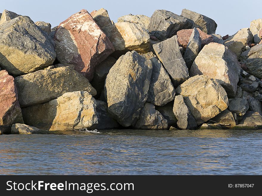 Rock breakwater structure protecting Sulina channel from strong sea waves where Danube flows into the Black Sea. Rock breakwater structure protecting Sulina channel from strong sea waves where Danube flows into the Black Sea.