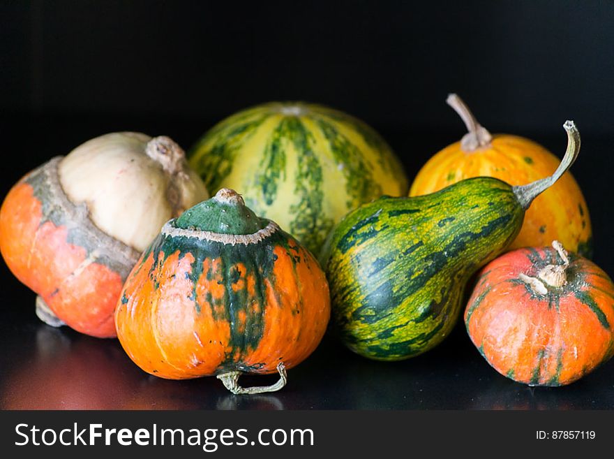 Brightly colored pumpkins and squashes primarily used for ornamental purposes.