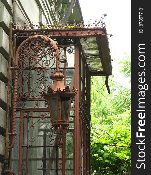 rusty-framework-and-lamp-of-porch