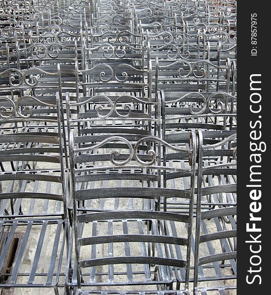 rows-of-empty-iron-chairs