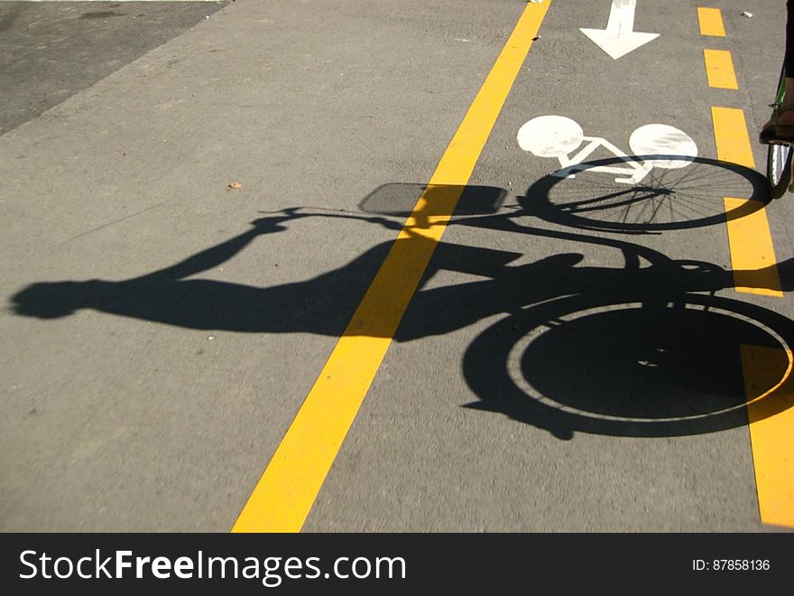 shadow-of-a-girl-riding-bicycle