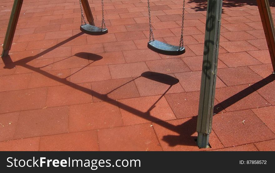 swings-casting-shadow-on-playground