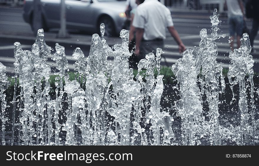 Fountain taken with very short exposure so that bulk flow and water droplets are both clearly defined, urban Summer background. Fountain taken with very short exposure so that bulk flow and water droplets are both clearly defined, urban Summer background.