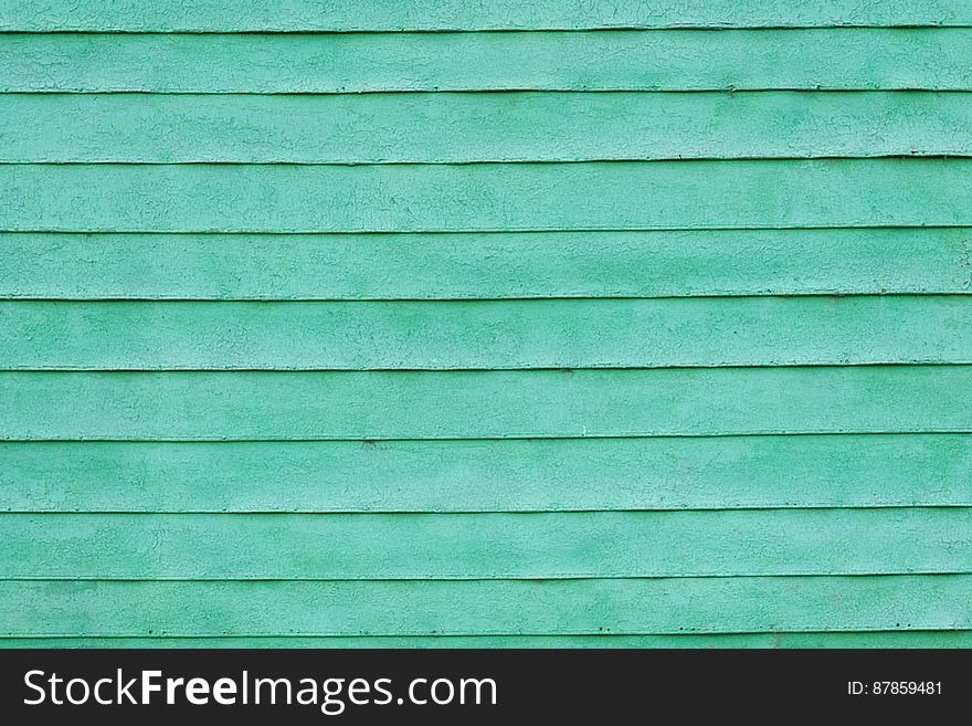 Green painted slats of house wall. Green painted slats of house wall