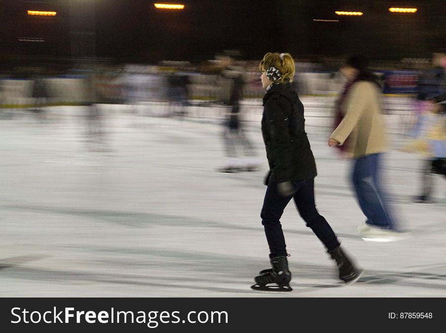 woman-gliding-on-ice-at-skating-rink
