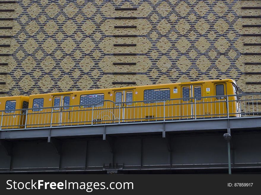 Yellow Train On Elevated Railway