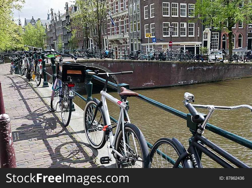 Bicycles Parked On An Amsterdam Bridge