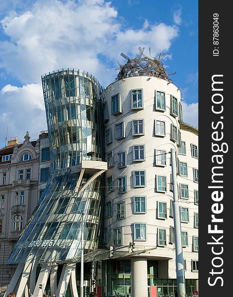 Formally nicknamed Fred and Ginger, the Dancing House in Prague is a modern building resembling two dancers. The unusual curved shapes and misaligned protruding