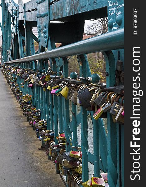 Tradition asks lovers to lock padlocks on Tumski Bridge in Wroclaw and throw the key in Odra river under the bridge.