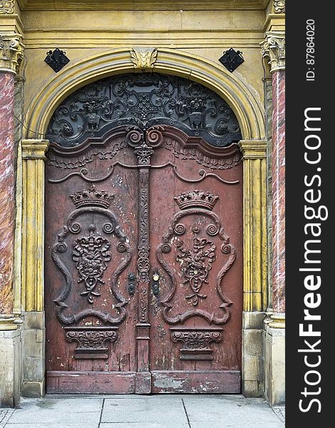 Crown Adorned Doors Of Baroque Building
