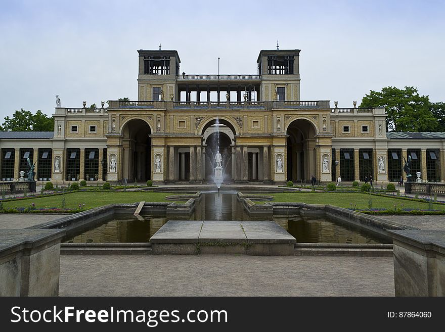 Overview of the Orangery Palace main entrance with the statue of its commisioner Frederick William IV in fron of the peristyle. Overview of the Orangery Palace main entrance with the statue of its commisioner Frederick William IV in fron of the peristyle.