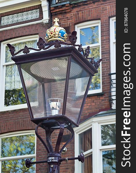 Street light in Amsterdam ornate with the Dutch Royal Crown on top. Street light in Amsterdam ornate with the Dutch Royal Crown on top.